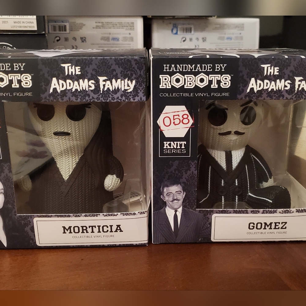 Morticia and Gomez figurines.